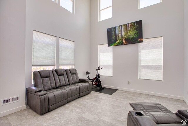 7776 S Iron Core Ln, West Jordan, UT 84081 - living room with a towering ceiling and baseboards
