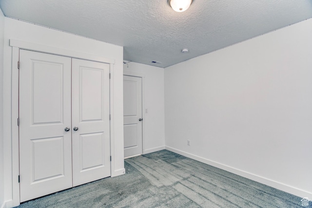 7776 S Iron Core Ln, West Jordan, UT 84081 - unfurnished bedroom with carpet, a closet, a textured ceiling, and baseboards