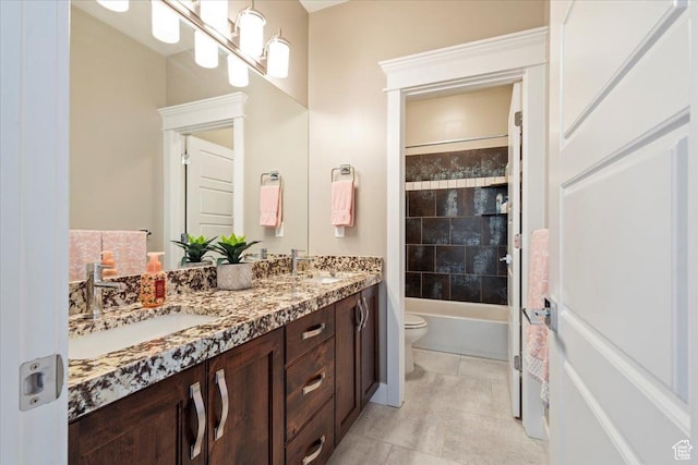 8176 S Chilwell Cv W, West Jordan, UT 84081 - full bath featuring double vanity, toilet, tile patterned flooring, and shower / bathtub combination