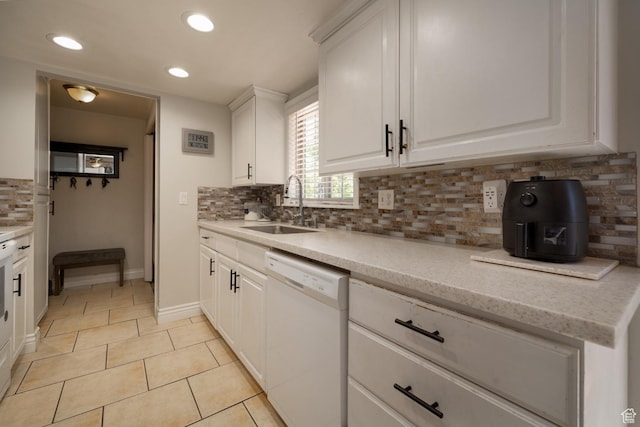 392 N 600 E, Roosevelt, UT 84066 - kitchen featuring white dishwasher, a sink, light tile patterned floors, tasteful backsplash, and white cabinets