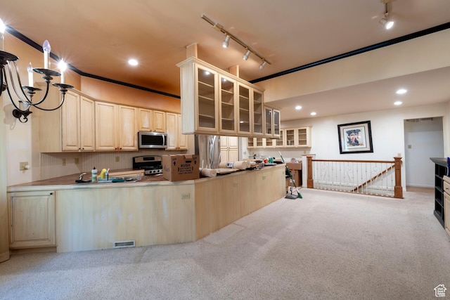 3695 S 2140 E, Salt Lake City, UT 84109 - kitchen featuring stainless steel appliances, track lighting, light brown cabinetry, light carpet, and glass insert cabinets