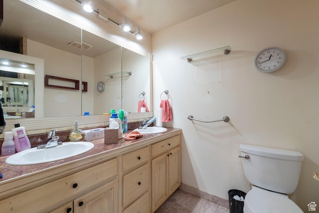 3695 S 2140 E, Salt Lake City, UT 84109 - full bathroom with double vanity, toilet, baseboards, and tile patterned flooring