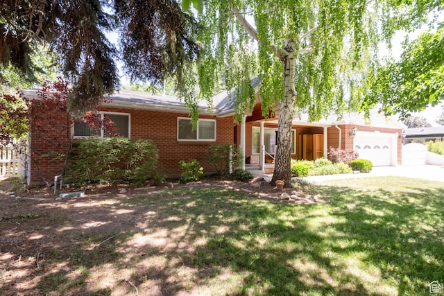 3695 S 2140 E, Salt Lake City, UT 84109 - ranch-style house with brick siding, driveway, a front lawn, and a garage