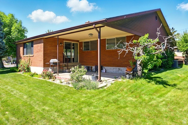 1130 W 1200 N, Provo, UT 84604 - rear view of house with a lawn, a patio, and brick siding