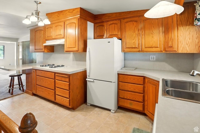 1130 W 1200 N, Provo, UT 84604 - kitchen featuring white appliances, a sink, light countertops, and under cabinet range hood