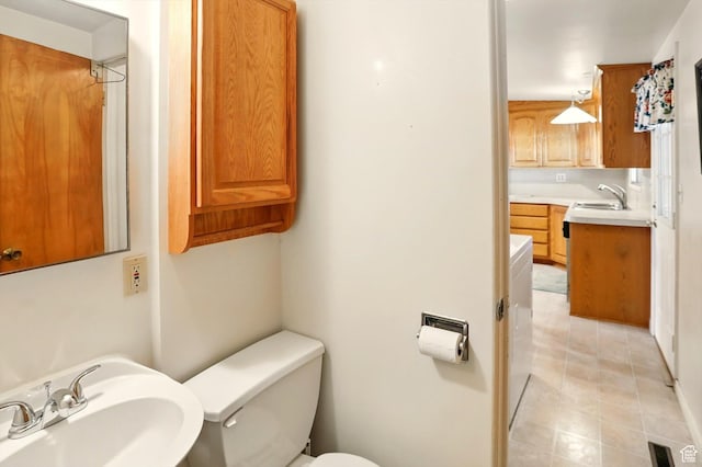 1130 W 1200 N, Provo, UT 84604 - bathroom featuring a sink, toilet, and tile patterned flooring