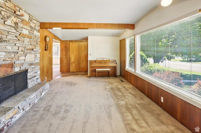 1130 W 1200 N, Provo, UT 84604 - carpeted living room featuring wooden walls and a stone fireplace