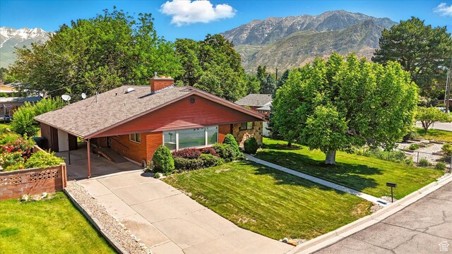 1130 W 1200 N, Provo, UT 84604 - view of front facade featuring a mountain view, a carport, and driveway