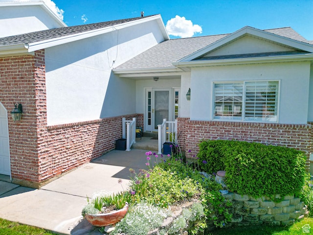 584 S Oak Ln, Tooele, UT 84074 - entrance to property with brick siding, a shingled roof, and stucco siding