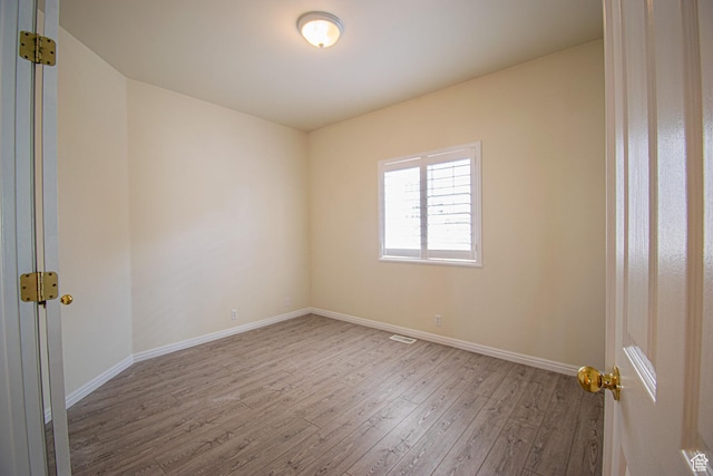 584 S Oak Ln, Tooele, UT 84074 - empty room with wood-type flooring and baseboards