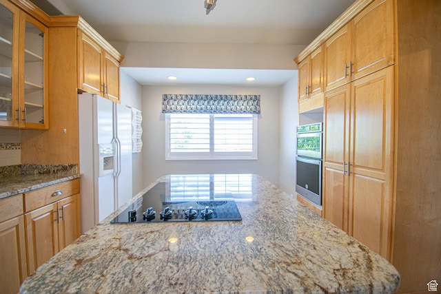 584 S Oak Ln, Tooele, UT 84074 - kitchen featuring white refrigerator with ice dispenser, stainless steel double oven, black electric stovetop, light stone counters, and recessed lighting