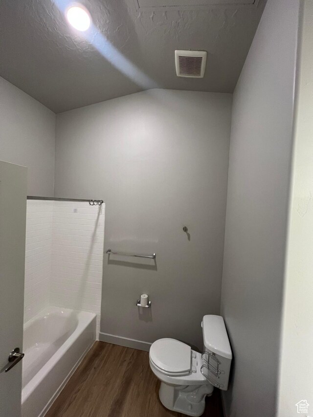 1140 W 950 N Unit C401, Orem, UT 84057 - full bath with wood finished floors, toilet, a bath, baseboards, and lofted ceiling