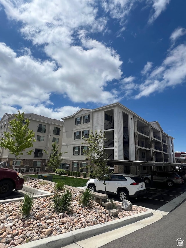 1140 W 950 N Unit C401, Orem, UT 84057 - view of apartment building / complex with uncovered parking