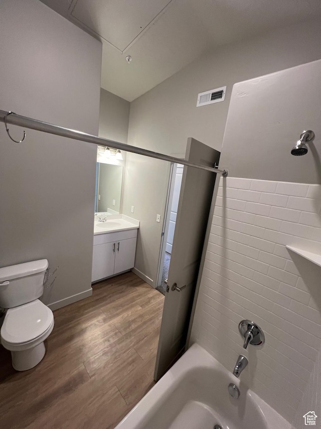 1140 W 950 N Unit C401, Orem, UT 84057 - bathroom featuring lofted ceiling, wood finished floors, toilet, vanity, and shower / tub combination
