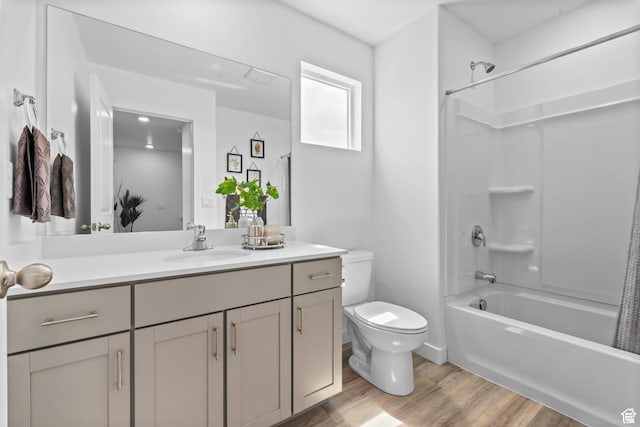 1897 E Thunder Ln Unit 498, Eagle Mountain, UT 84005 - full bathroom with toilet, vanity, wood finished floors, and bathing tub / shower combination