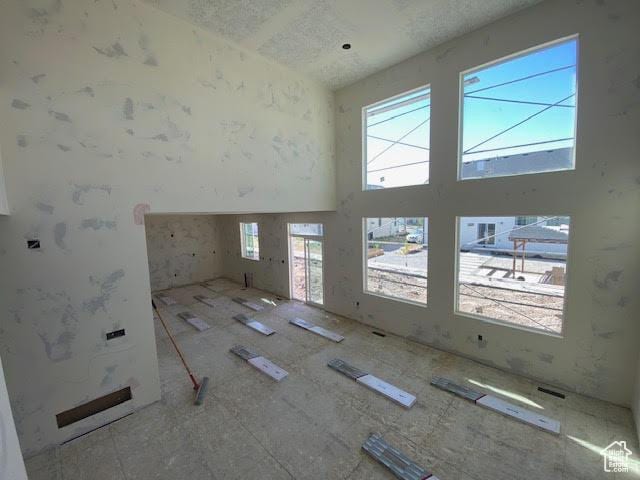422 W Sapphire Dr Unit 7011, Tooele, UT 84074 - unfurnished room with a towering ceiling