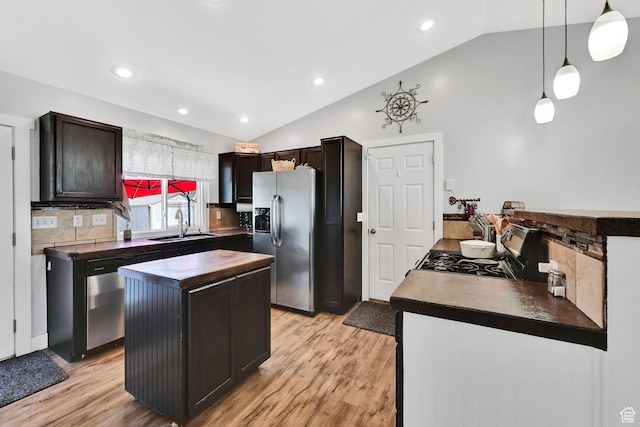 3926 W 5100 S, Roy, UT 84067 - kitchen featuring stainless steel appliances, vaulted ceiling, a kitchen island, a sink, and light wood finished floors