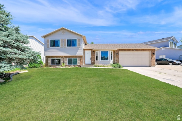 3926 W 5100 S, Roy, UT 84067 - split level home featuring brick siding, a garage, concrete driveway, and a front yard