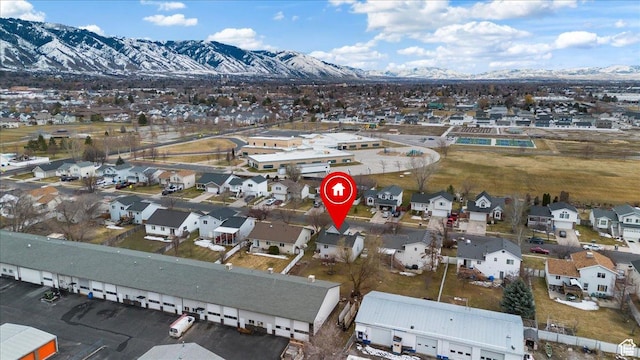 1587 N 565 W Unit 101, Logan, UT 84341 - aerial view of property and surrounding area with nearby suburban area and a mountainous background