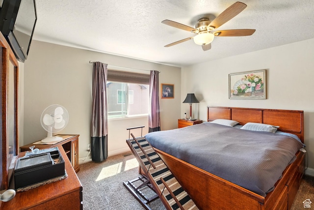1587 N 565 W Unit 101, Logan, UT 84341 - carpeted bedroom featuring baseboards, a textured ceiling, and ceiling fan