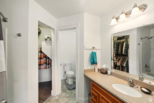 1587 N 565 W Unit 101, Logan, UT 84341 - full bath featuring vanity, a walk in closet, toilet, tub / shower combination, and baseboards