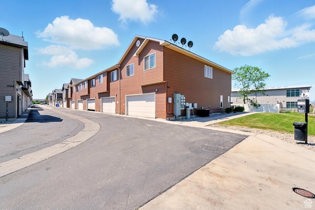 1587 N 565 W Unit 101, Logan, UT 84341 - view of asphalt road featuring a residential view