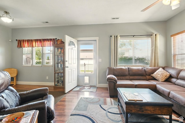 1587 N 565 W Unit 101, Logan, UT 84341 - living room featuring healthy amount of natural light, ceiling fan, wood finished floors, and baseboards