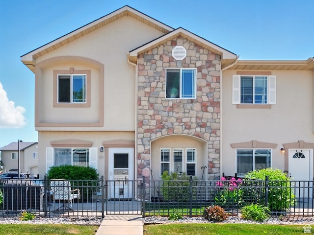 1587 N 565 W Unit 101, Logan, UT 84341 - view of front of home featuring stucco siding and stone siding
