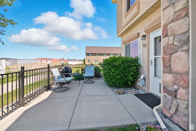1587 N 565 W Unit 101, Logan, UT 84341 - view of patio / terrace featuring a balcony