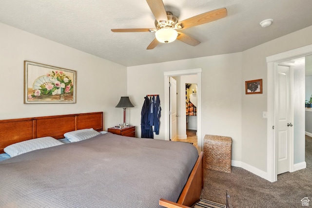 1587 N 565 W Unit 101, Logan, UT 84341 - bedroom featuring carpet floors, baseboards, a ceiling fan, and a spacious closet