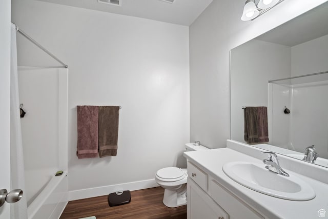 1809 W Terra Vista Ln Unit H202, Saratoga Springs, UT 84045 - bathroom featuring vanity, baseboards, wood finished floors, toilet, and shower / bathtub combination with curtain