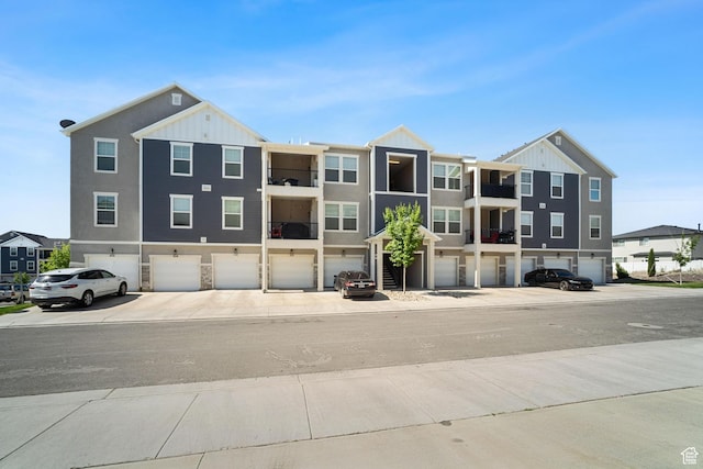 1809 W Terra Vista Ln Unit H202, Saratoga Springs, UT 84045 - view of front of house featuring a garage and board and batten siding