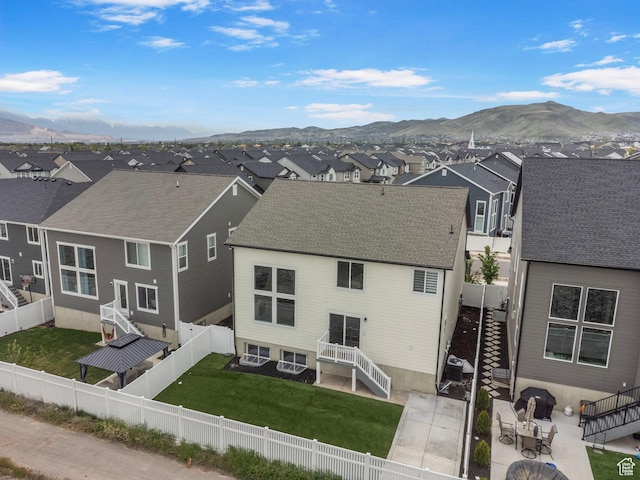 6636 W Ipswitch Way S, Herriman, UT 84096 - rear view of property featuring a residential view, a mountain view, stairs, and a patio