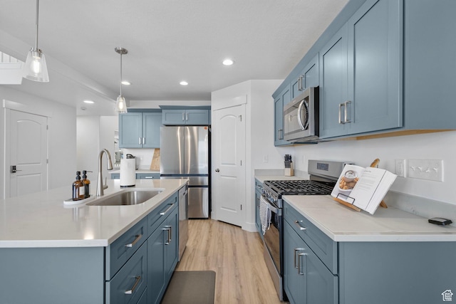 6636 W Ipswitch Way S, Herriman, UT 84096 - kitchen with stainless steel appliances, a sink, recessed lighting, light countertops, and light wood-style flooring