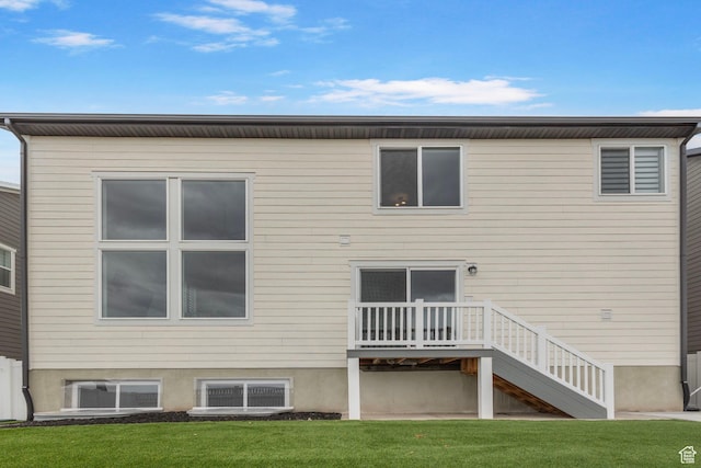 6636 W Ipswitch Way S, Herriman, UT 84096 - rear view of property featuring a lawn and stairway