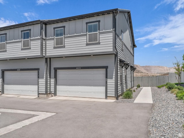 4423 E Longleaf Ln, Eagle Mountain, UT 84005 - view of front of house featuring board and batten siding and an attached garage