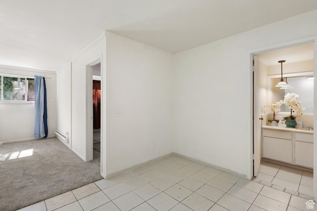 350 E 700 S Unit K102, Salt Lake City, UT 84111 - empty room with a baseboard heating unit and light tile patterned floors
