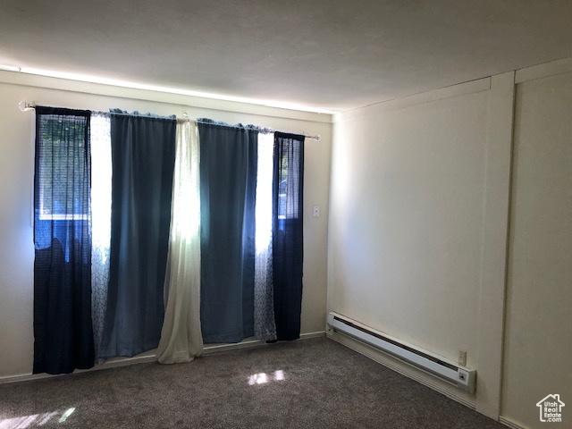 350 E 700 S Unit K102, Salt Lake City, UT 84111 - carpeted spare room featuring a baseboard radiator