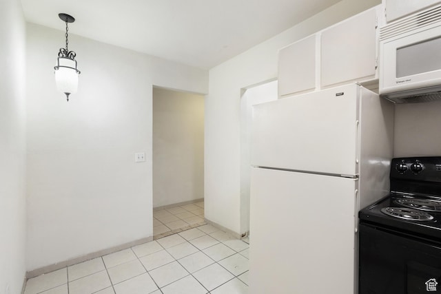 350 E 700 S Unit K102, Salt Lake City, UT 84111 - kitchen with white appliances, white cabinetry, light tile patterned floors, hanging light fixtures, and baseboards