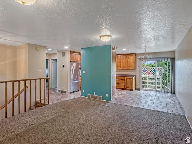 485 W Cottonwood Ln, Ferron, UT 84523 - unfurnished living room with a chandelier, a textured ceiling, light colored carpet, baseboards, and recessed lighting