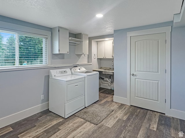 485 W Cottonwood Ln, Ferron, UT 84523 - washroom featuring washer and dryer, cabinet space, baseboards, dark wood-style flooring, and a textured ceiling