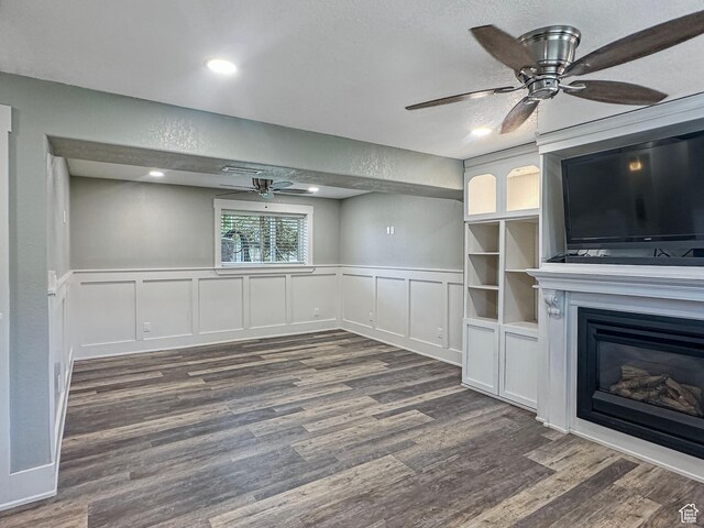 485 W Cottonwood Ln, Ferron, UT 84523 - unfurnished living room featuring a ceiling fan, dark wood-style floors, a decorative wall, wainscoting, and recessed lighting