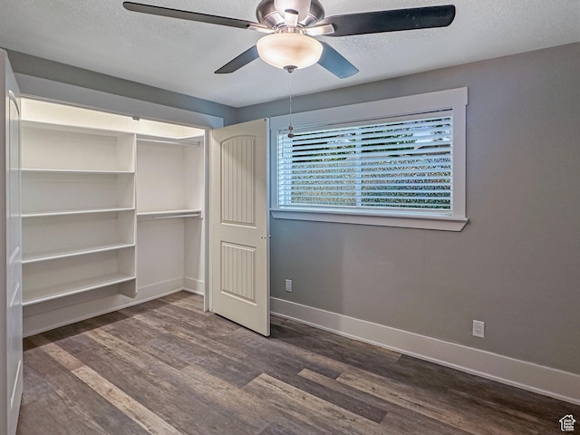 485 W Cottonwood Ln, Ferron, UT 84523 - unfurnished bedroom featuring wood finished floors, baseboards, a closet, ceiling fan, and a textured ceiling