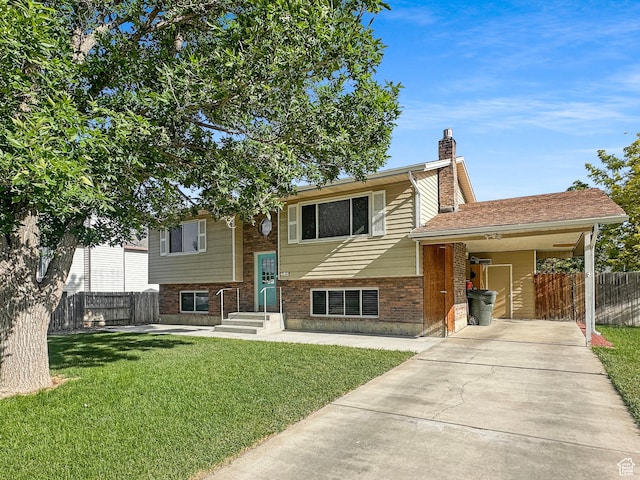 485 W Cottonwood Ln, Ferron, UT 84523 - view of front facade with brick siding, a chimney, driveway, and a carport