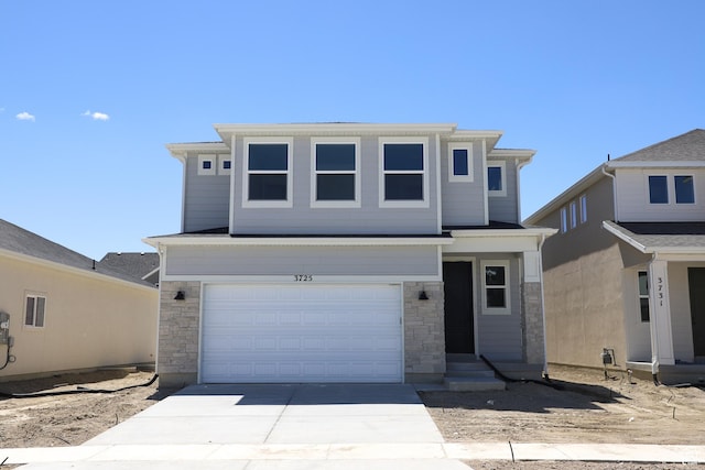 3725 N Janie St Unit 1013, Eagle Mountain, UT 84005 - view of front facade with stone siding, concrete driveway, and a garage
