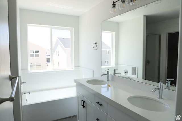 3725 N Janie St Unit 1013, Eagle Mountain, UT 84005 - bathroom featuring plenty of natural light, double vanity, and a bath