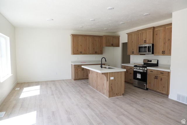 3705 N Janie St Unit 1016, Eagle Mountain, UT 84005 - kitchen featuring appliances with stainless steel finishes, a sink, light wood-type flooring, light countertops, and recessed lighting
