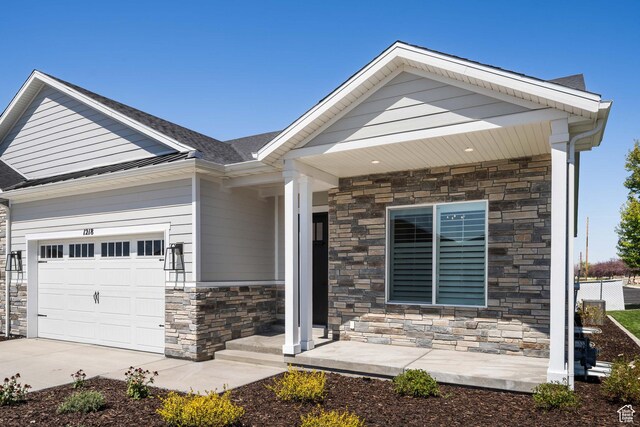 1252 W 770 S Unit 104, Heber City, UT 84032 - craftsman-style home with stone siding, a garage, and driveway
