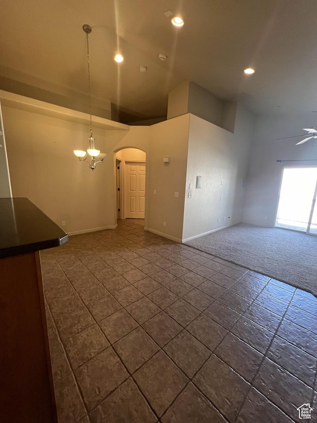 1593 W 110 N Unit 4, Pleasant Grove, UT 84062 - unfurnished room with arched walkways, recessed lighting, baseboards, dark carpet, and a ceiling fan