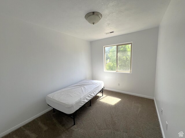 1167 E 400 S Unit 22, St George, UT 84790 - bedroom featuring baseboards and carpet floors